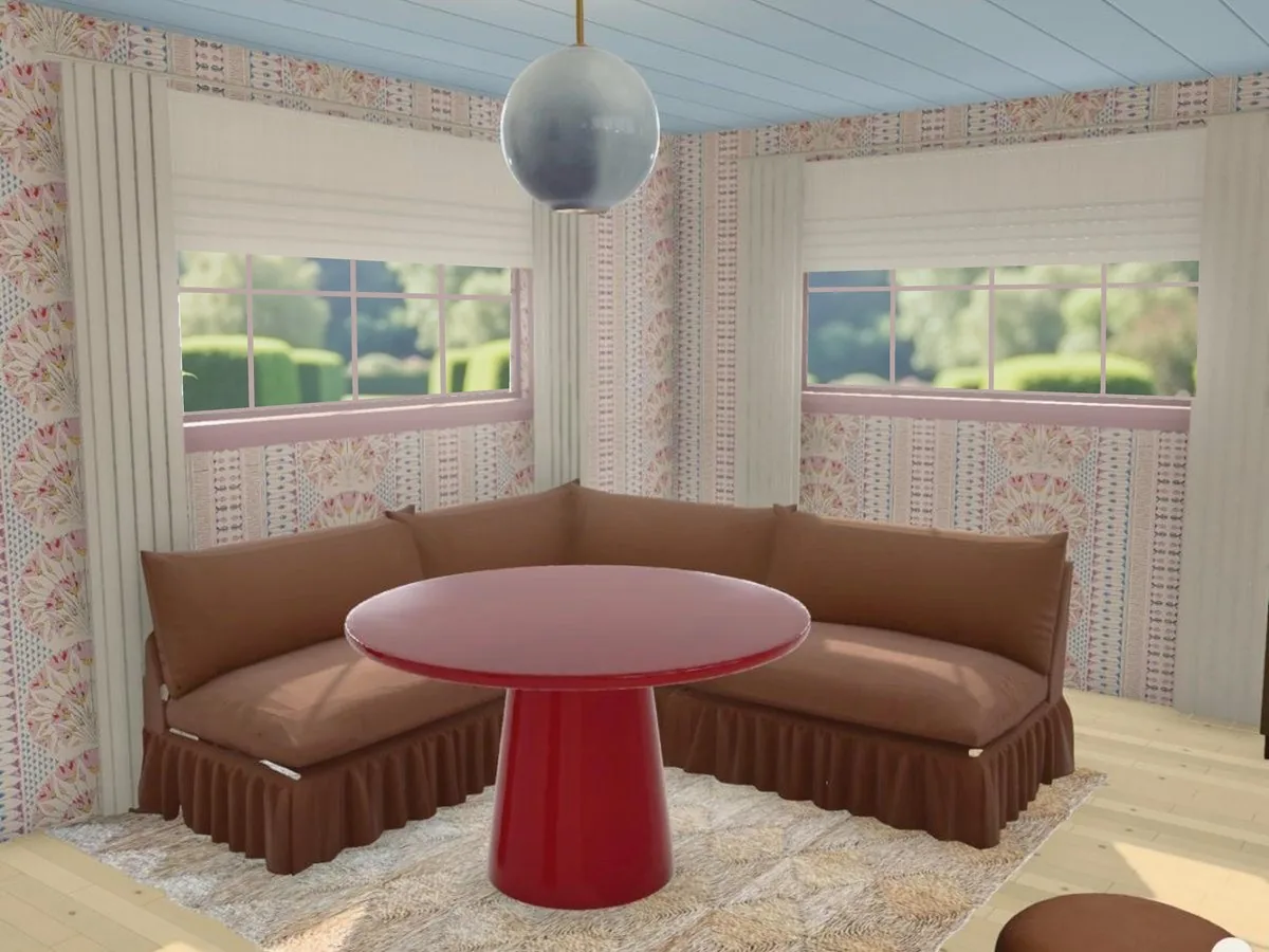 A kitchen nook in elsewhere: a brown corner banquette and a red lacquer table on a seagrass rug, under striped floral wallpaper and a blue plank ceiling